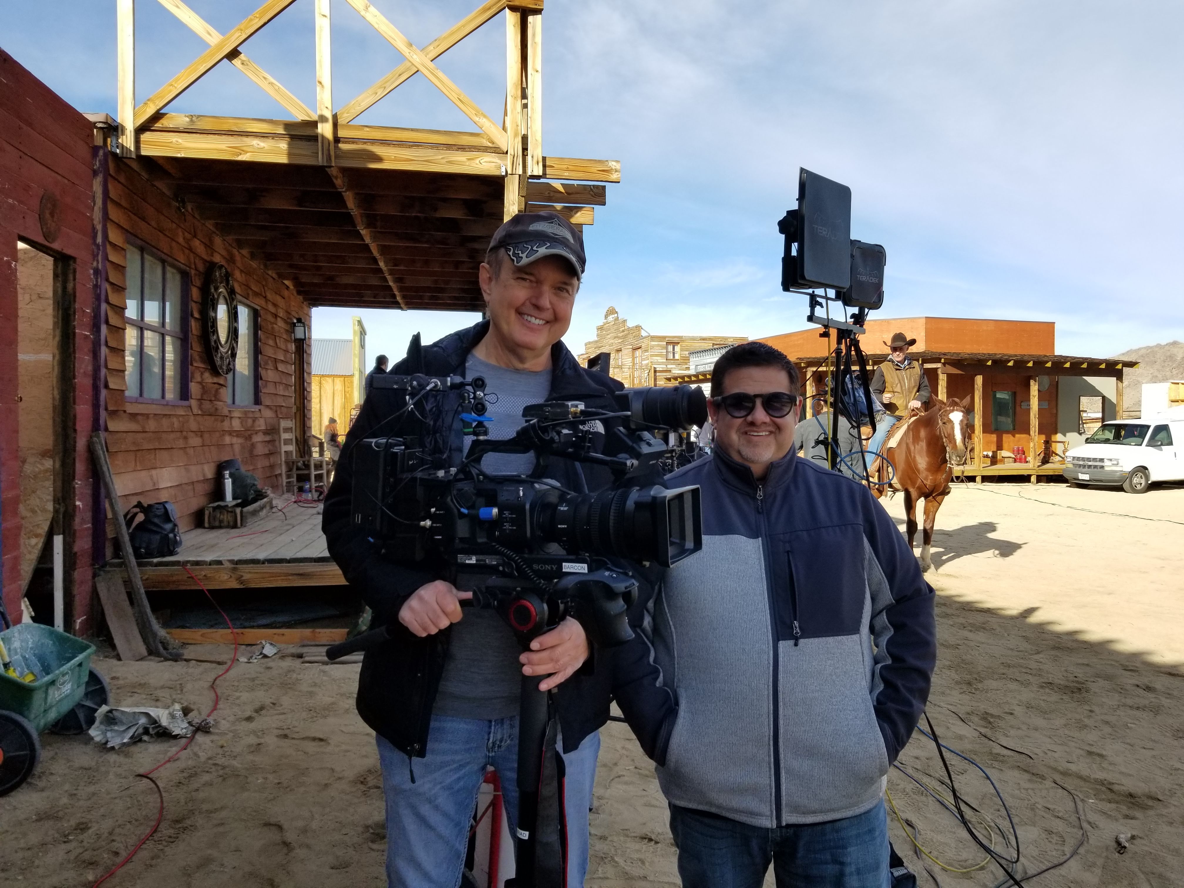 Stephen and a camera operator on a western backlot